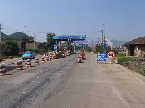 Toll Gate, bicyclists to the far right.